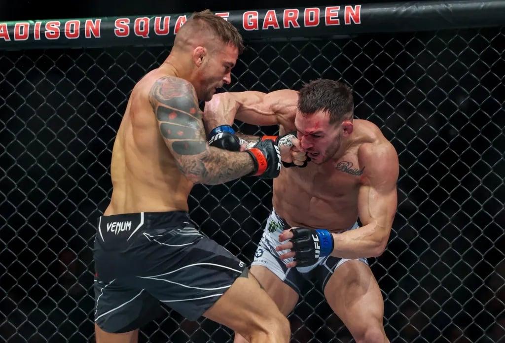 Dustin Poirier cracking Michael Chandler in their bout at UFC 281. Credits to: Jessica Alcheh - USA TODAY Sports.