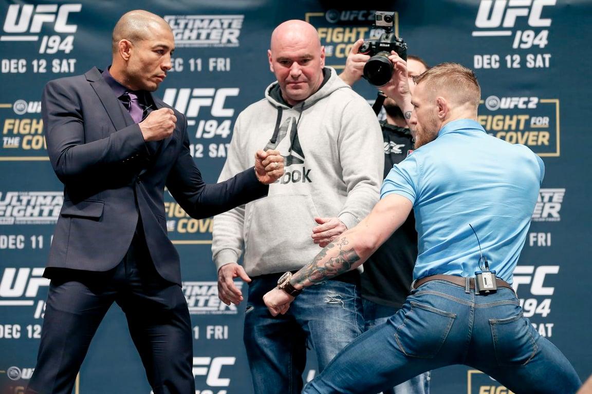 Jose Aldo and Conor McGregor face off 2 days before their fight. (Esther Lin - MMA Fighting)