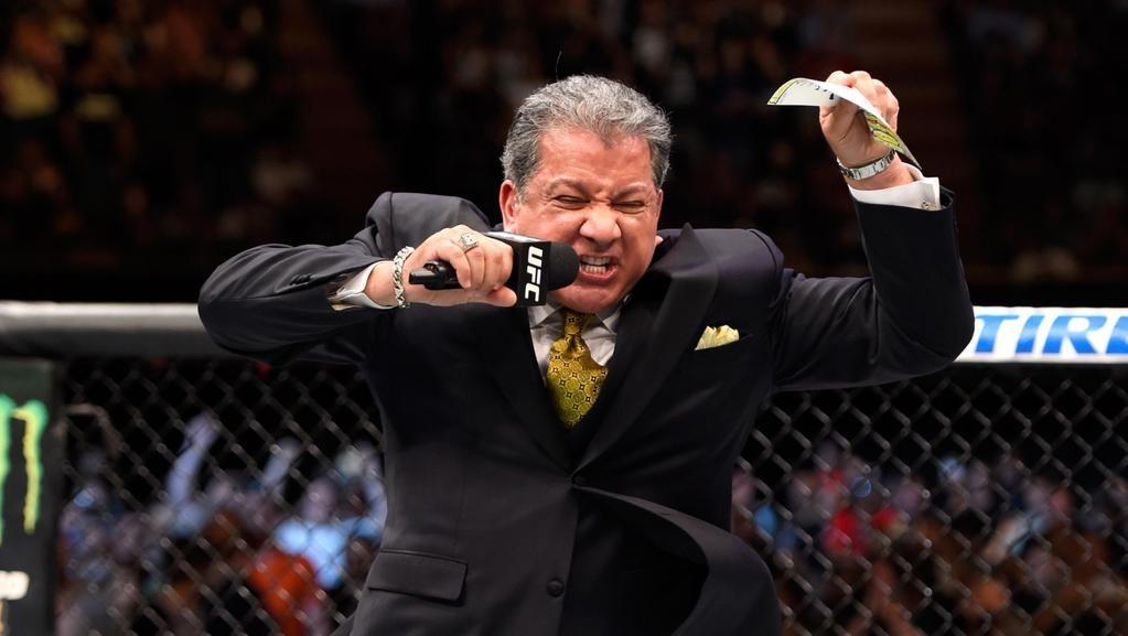 Bruce Buffer doing his thing inside the octagon. Credit: PerthNow.