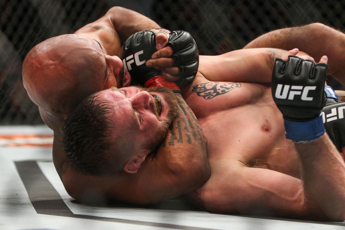 Demetrious Johnson applies a choke to Tim Elliot. Credit: MMA Fighting.