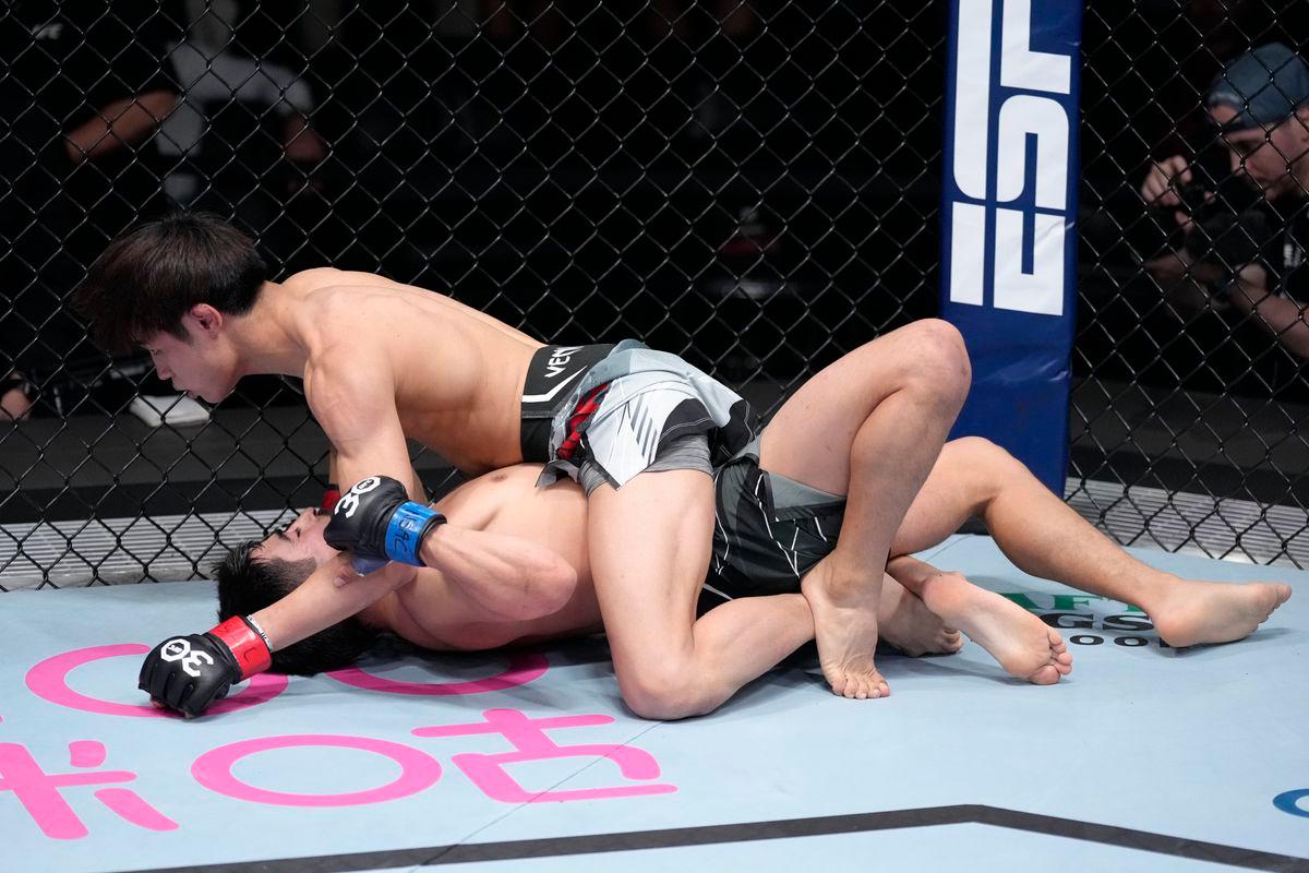 Tatsuro Taira holds full mount on Jesus Aguilar. Credit: MMA Fighting.