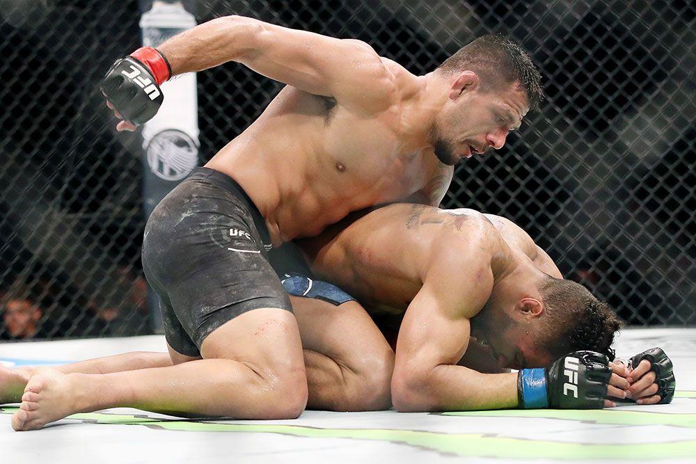 Dos Anjos pours on the punishment against Kevin Lee. Credits to: USA TODAY Sports
