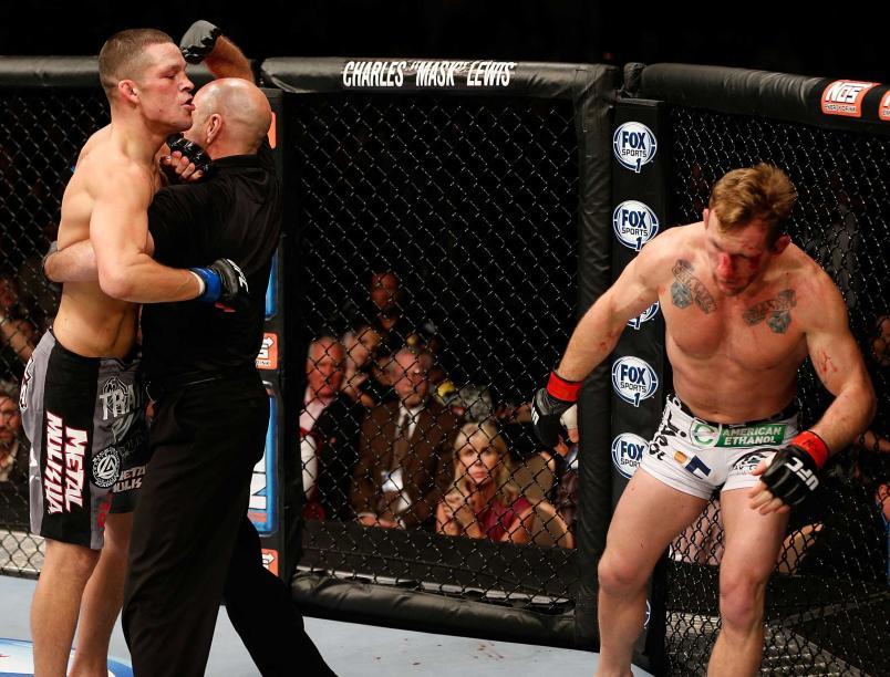 The referee saves Gray Maynard from further damage against Nate Diaz. Credits to: Josh Hedges/Zuffa LLC