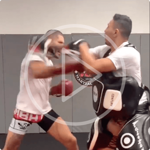 Alex Pereira hitting pads with his coach