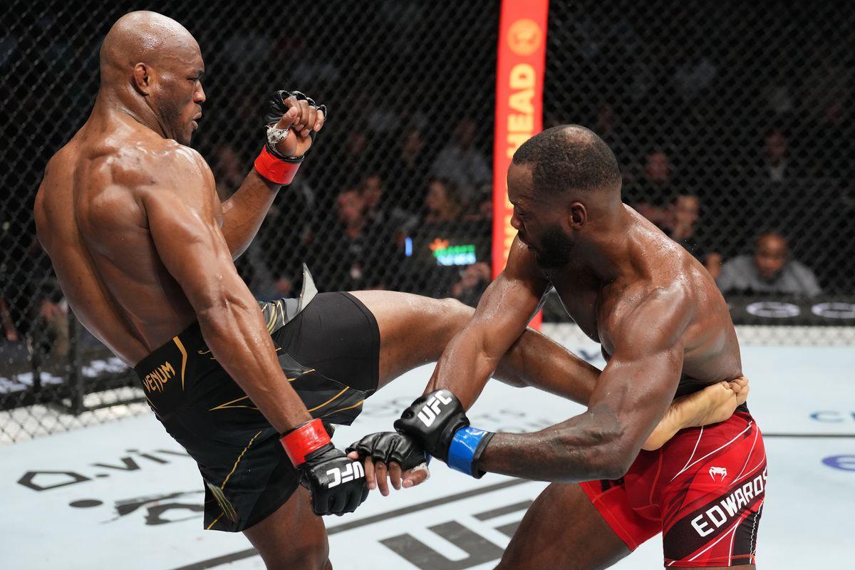 Kamaru Usman lands a body kick on Leon Edwards. Credit: MMA Fighting.