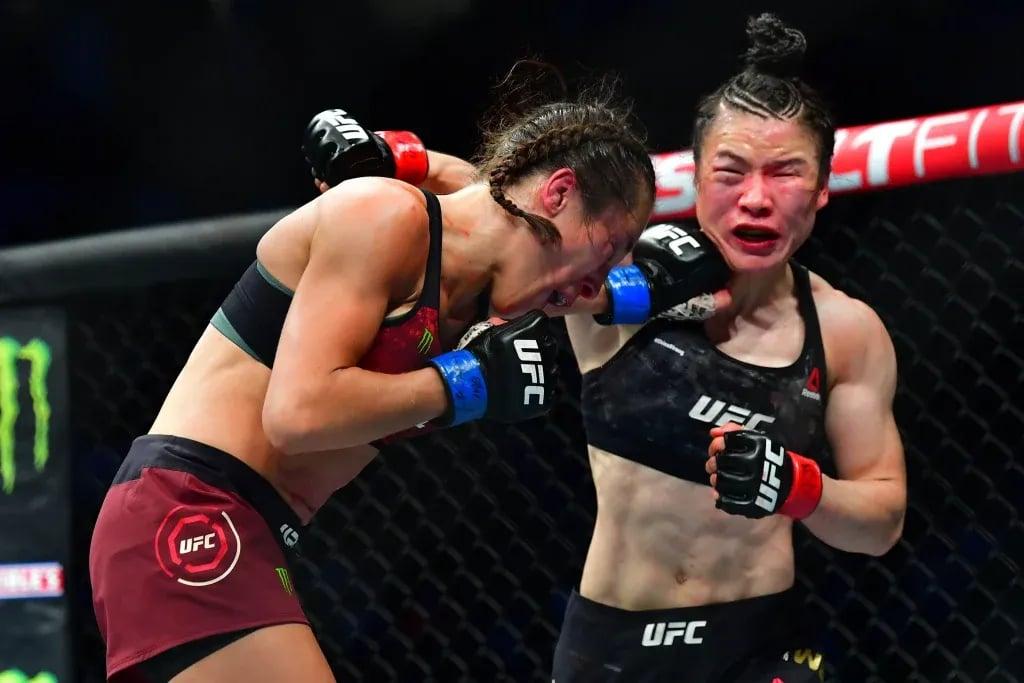 Two of the best female fighters of all time, Weili and Jędrzejczyk, engaging in one of the greatest UFC fights of all time at UFC 248. Credits to: Stephen R. Sylvanie - USA TODAY Sports.