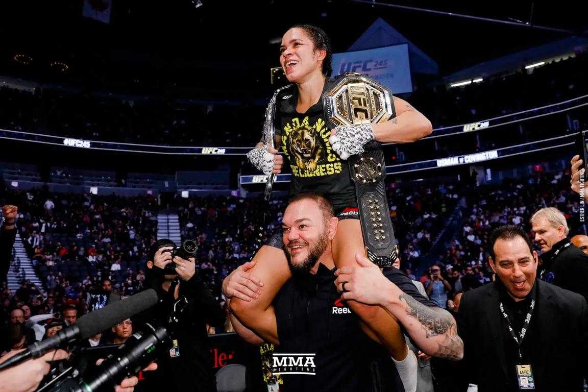 Amanda Nunes celebrates double champ status after defeating Germaine de Randamie. Credits to: Esther Lin-MMA Fighting