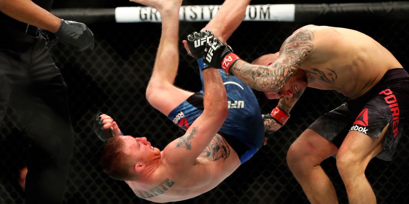 Justin Gaethje throwing a rolling thunder against Dustin Poirier in their chaotic first bout. Credits to: Mark J. Rebilas - USA TODAY Sports.