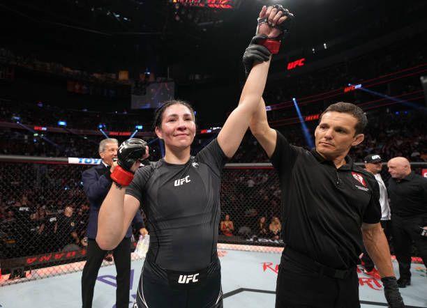 Irene Aldana getting her hand raised at UFC 279. Credits to: Jeff Bottari-Zuffa LLC.