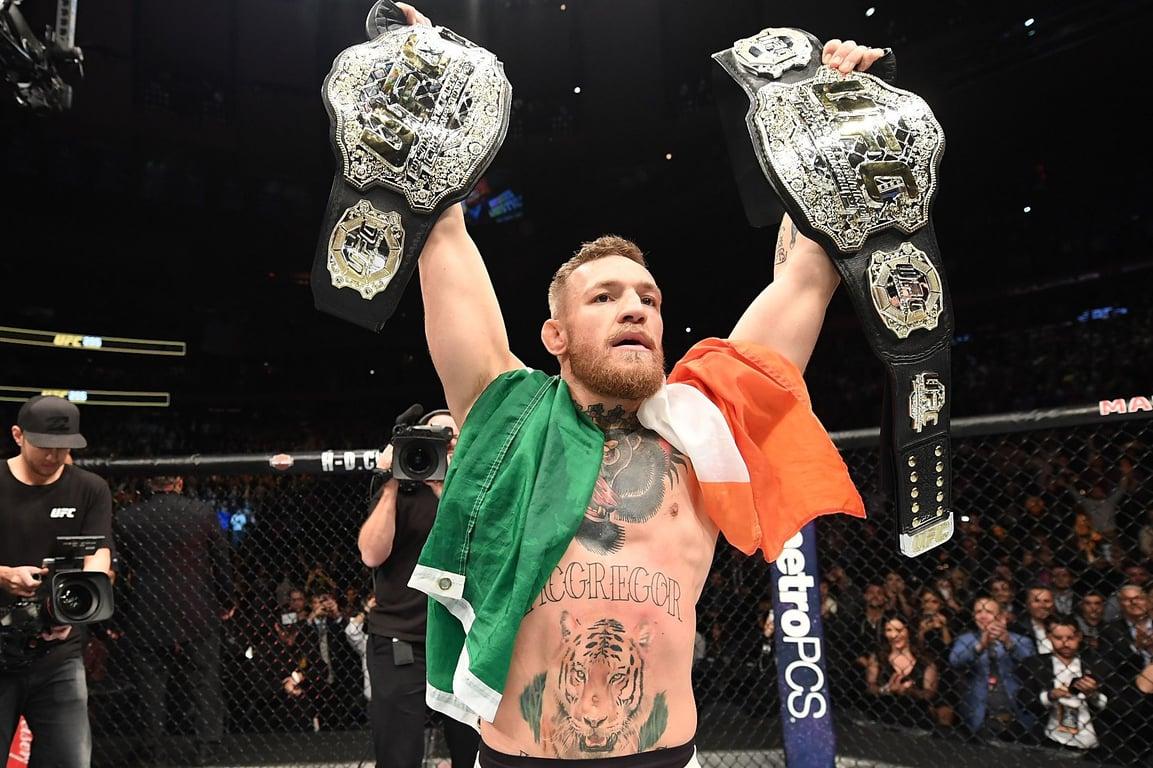 Conor McGregor holding both the UFC Featherweight and Lightweight Championship titles. Credits to: Jeff Bottari/Zuffa LLC