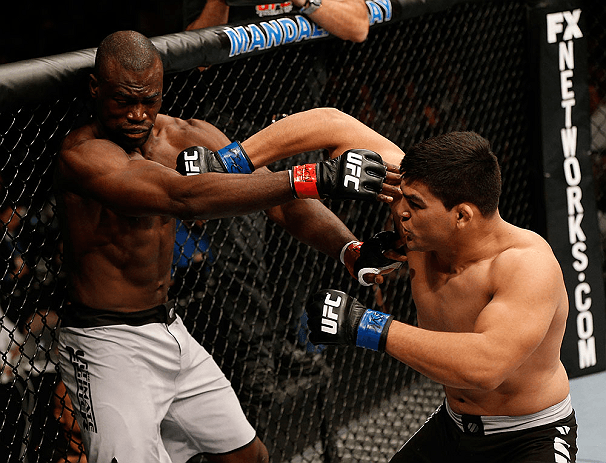 Kelvin Gastelum lands a big right hand on Uriah Hall in the finals. Credits to: Zuffa LLC-Getty Images