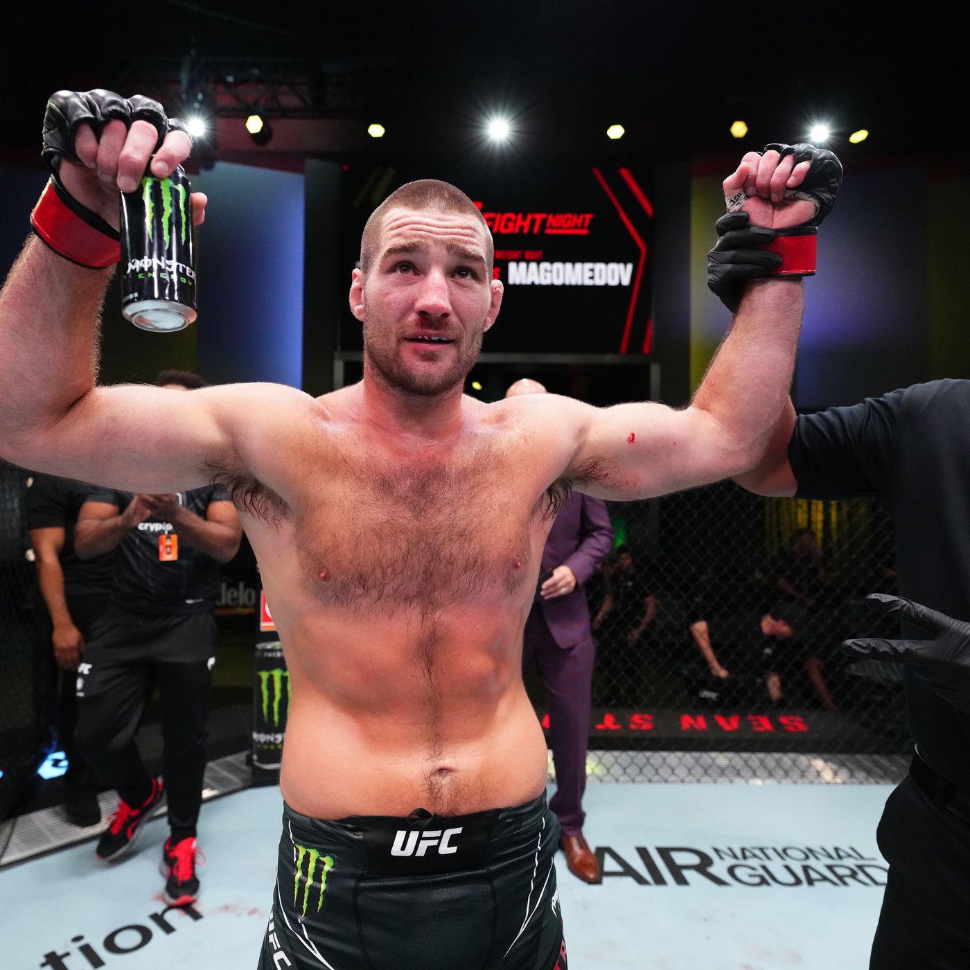 Sean Strickland raises his hands after defeating Abus Magomedov. Chris Unger - Zuffa LLC via Getty Images