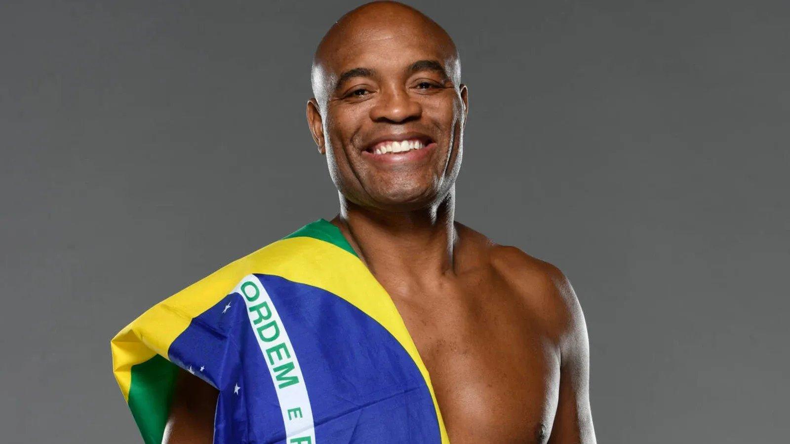 Anderson Silva smiles with the Brazilian flag. Credit: Mike Roach - Zuffa LLC via Getty Images.