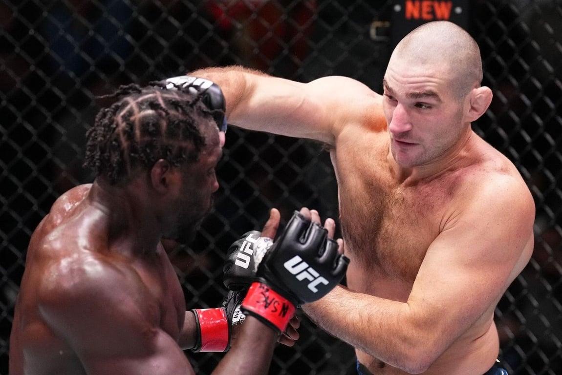 Sean Strickland lands a right hand against Jared Cannonier. Credits to Zuffa LLC.
