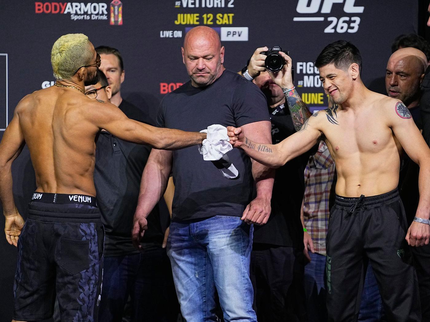 A show of respect between Brandon Moreno and Deiveson Figueiredo at UFC 263. Credit to: Bloody Elbow.