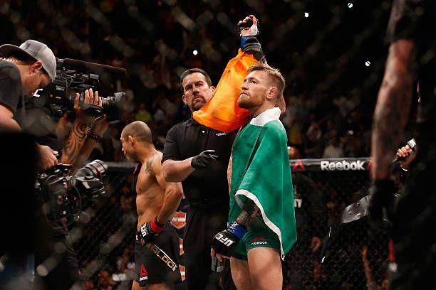 Conor McGregor getting his hand raised as the winner against José Aldo at UFC 194. Credits to: Christian Petersen - Zuffa LLC.