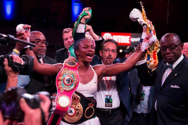 Claressa Shields with all of her boxing championship belts. Credits to: Mitchell Leff-Getty Images.