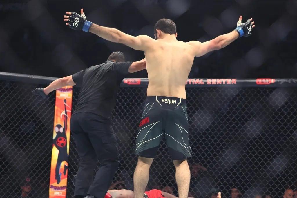 Ikram Aliskerov standing over Phil Hawes after KOing him at UFC 288. Credits to: Ed Mulholland - USA TODAY Sports.