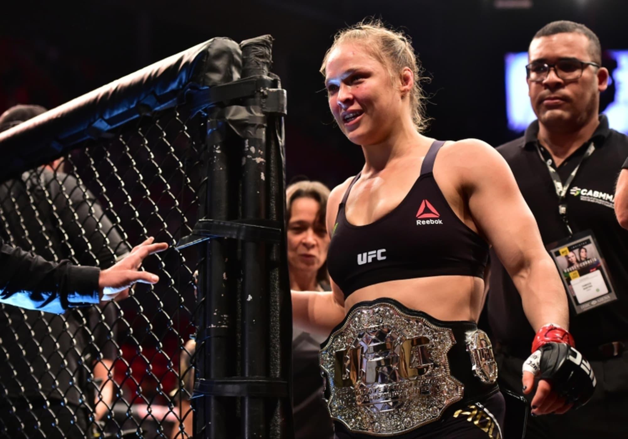 Ronda Rousey with her UFC Women's Bantamweight title. Credit: FanSided.