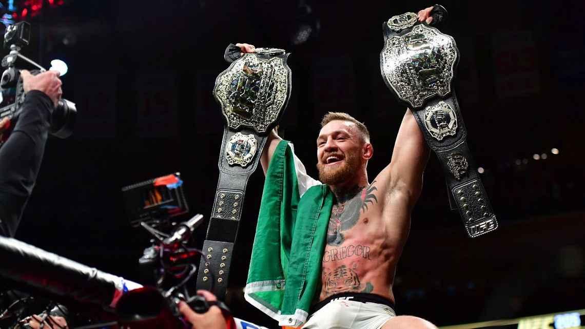 Conor McGregor raising both of his UFC Championships at Madison Square Garden. Credits to: Jason Silva/Zuma Press/Icon Sportswire
