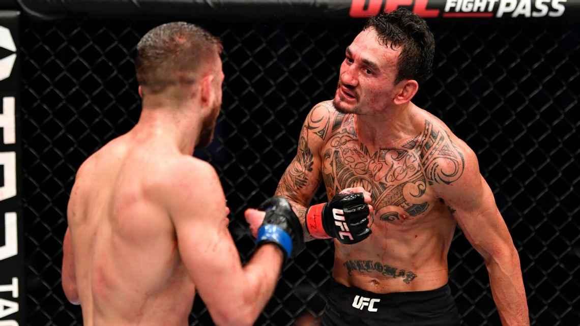 Max Holloway letting Calvin Kattar know that he's the best boxer in the UFC. Credits to: Jeff Bottari-Zuffa LLC.