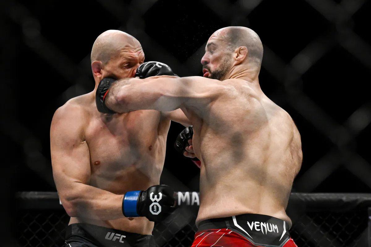 Bogdan Guskov exchanges punches with Volkan Oezdemir. Credit: MMA Junkie.