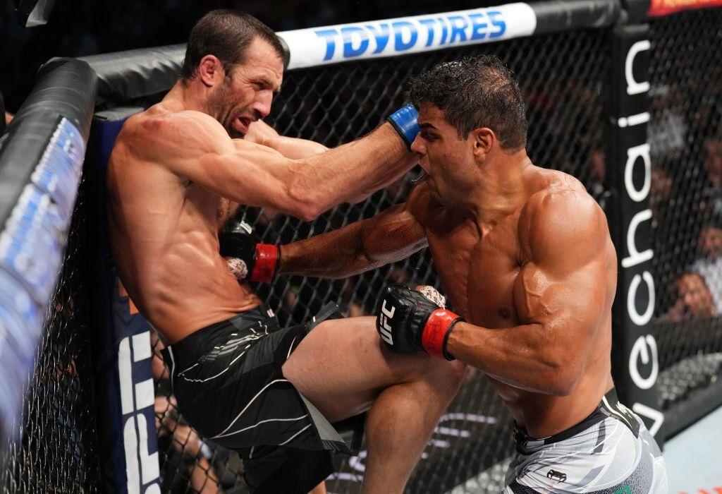 Paulo Costa and Luke Rockhold exchange back and forth strikes. Credits to: Josh Hedges of Zuffa LLC.
