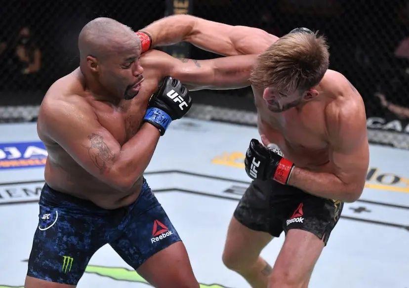 Stipe Miocic and Daniel Cormier trading blows in their Heavyweight war. Credits to: Bryan Tucker - MMA Fighting.